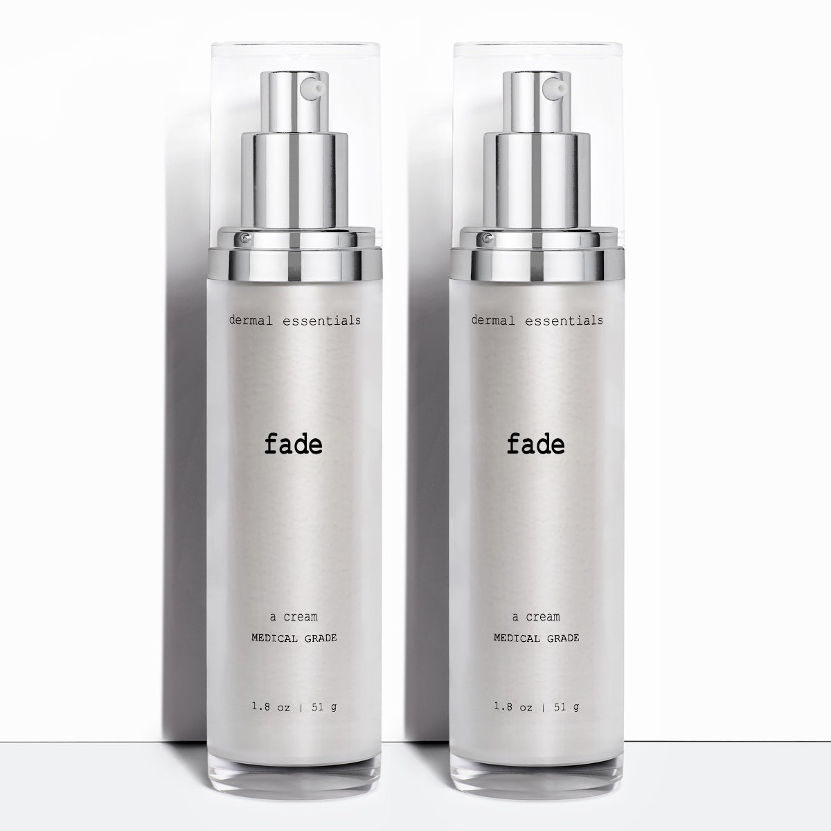 Two Silver cylinder plastic bottles black letters silver plastic pump clear plastic cap 1. 8 oz. Fade lighten hyperpigmentation cream Dermal Essentials Medical Grade