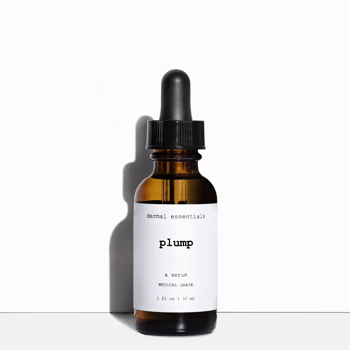 Glass amber cylinder bottle black eye dropper white label black letters 1 fl. oz. Plump anti-aging hyaluronic acid hydrating serum Dermal Essentials Medical Grade Skincare