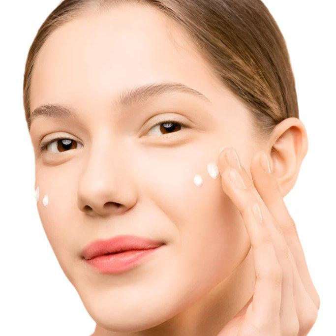 White woman light brown hair brown eyes applying face serum. Best anti-aging face serum. Dermal Essentials Medical Grade Skincare.