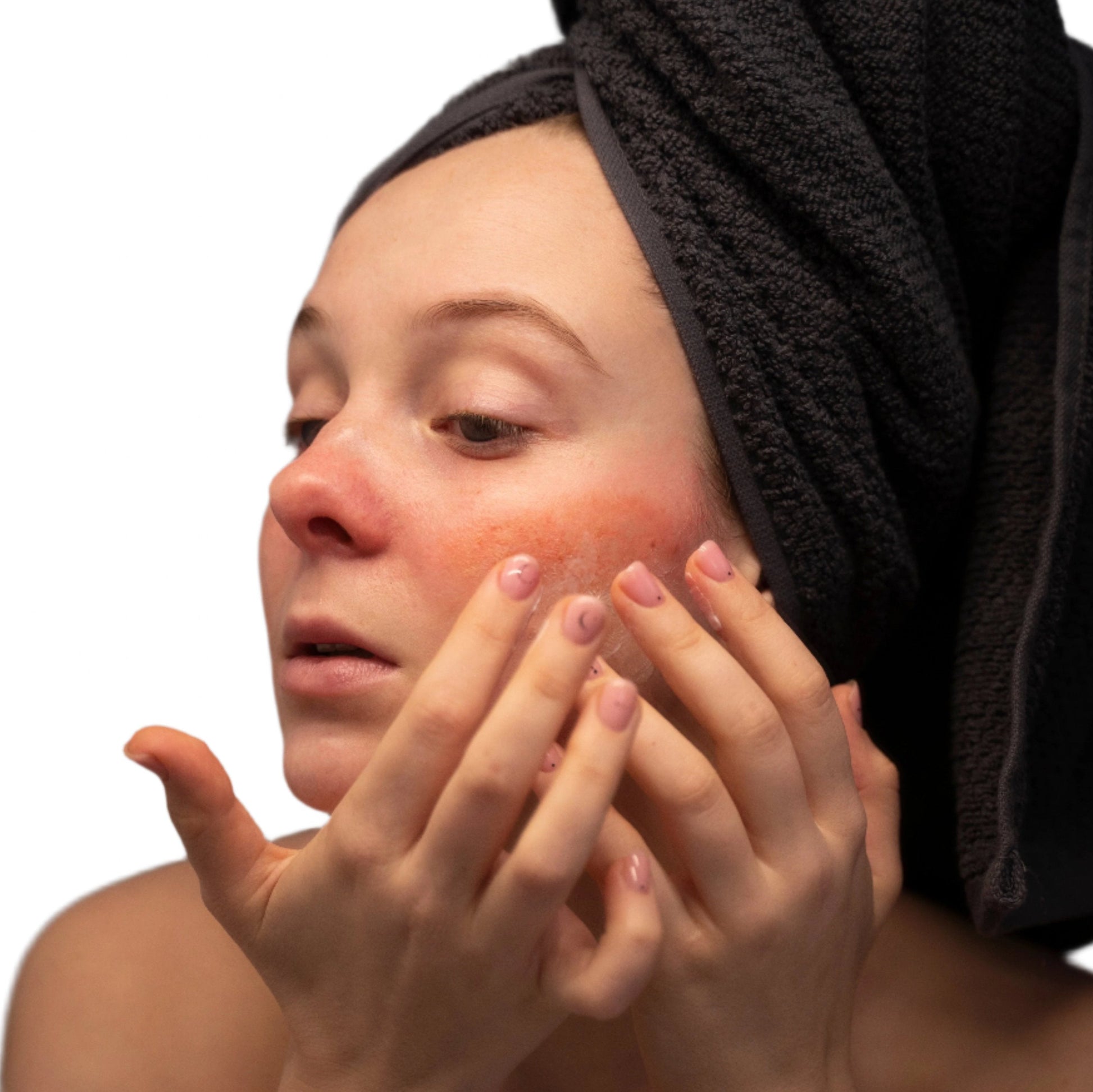 white woman black head towel red cheeks dermal essentials medical grade skincare