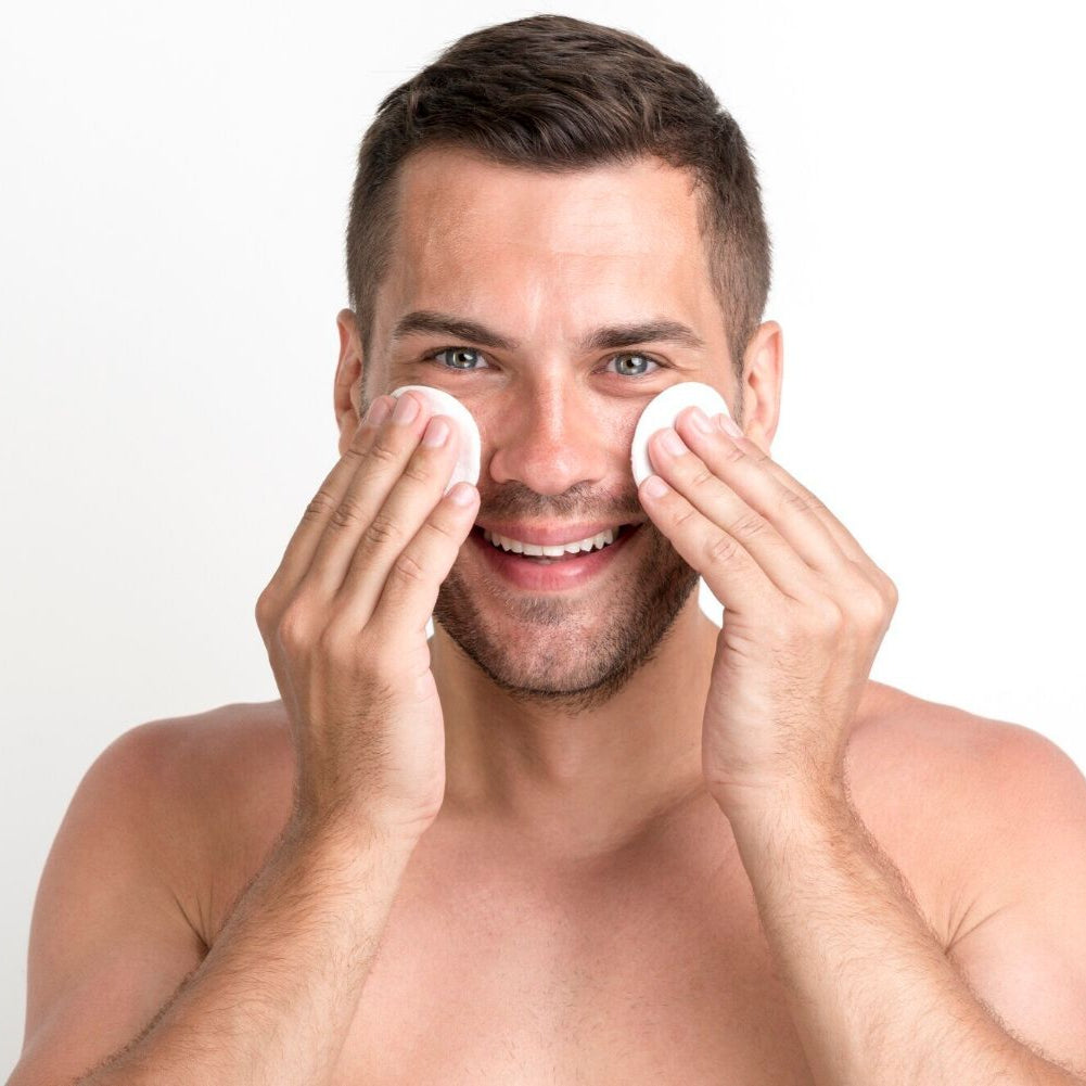 white man applying facial toner dermal essentials medical grade skincare