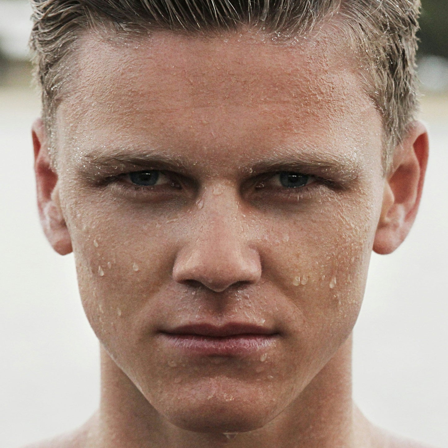 white male light brown hair water droplets on face dermal essentials medical grade skincare