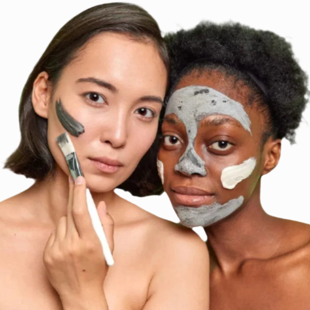 asian woman black woman applying sulphur acne facial mask with white brush dermal essentials clinical skincare
