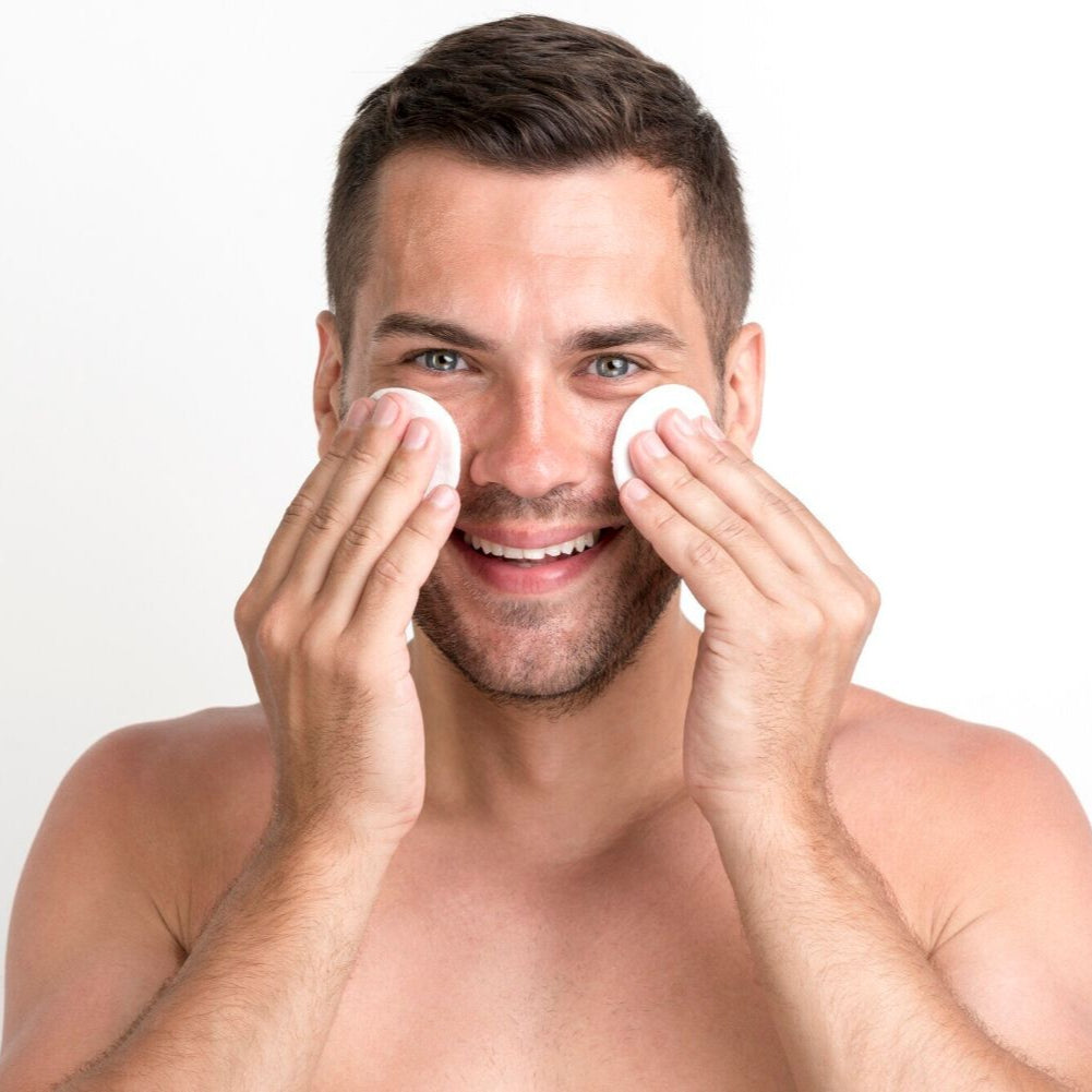 man applying facial toner dermal essentials medical grade skincare
