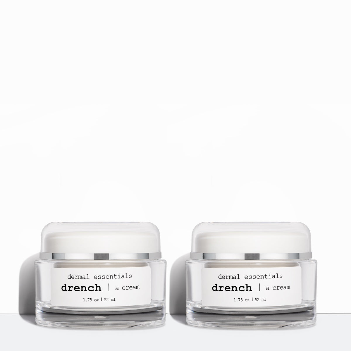 Two clear round plastic jars white label black letters white twist plastic lid 1.75 oz. Drench peptide ceramide antioxidant facial moisturizer Dermal Essentials Medical Skincare