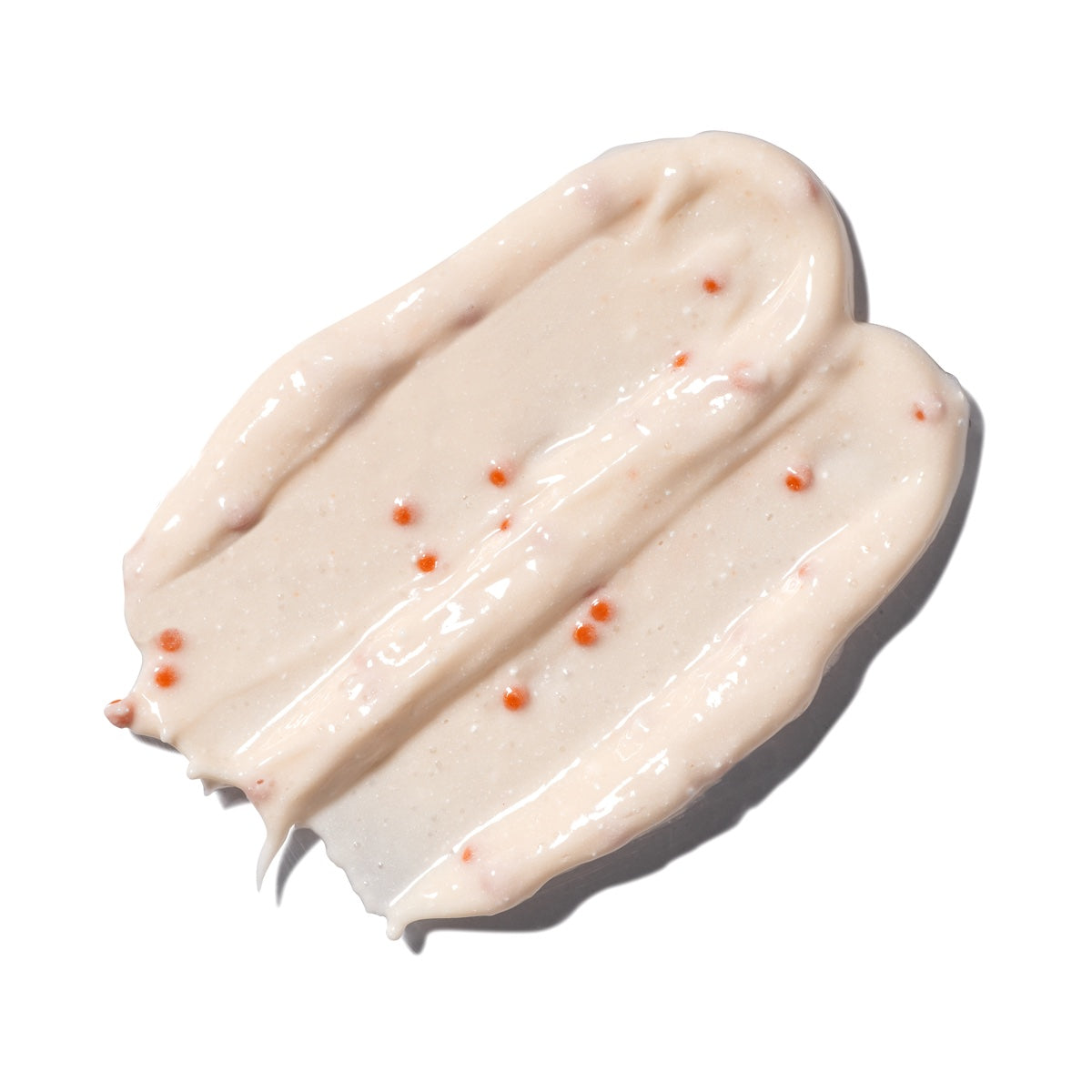 gently exfoliating self warming facial mask to remove impurities, reduce pore size and protect from free radical damage by dermal essentialsPeach color facial mask swatch smear.