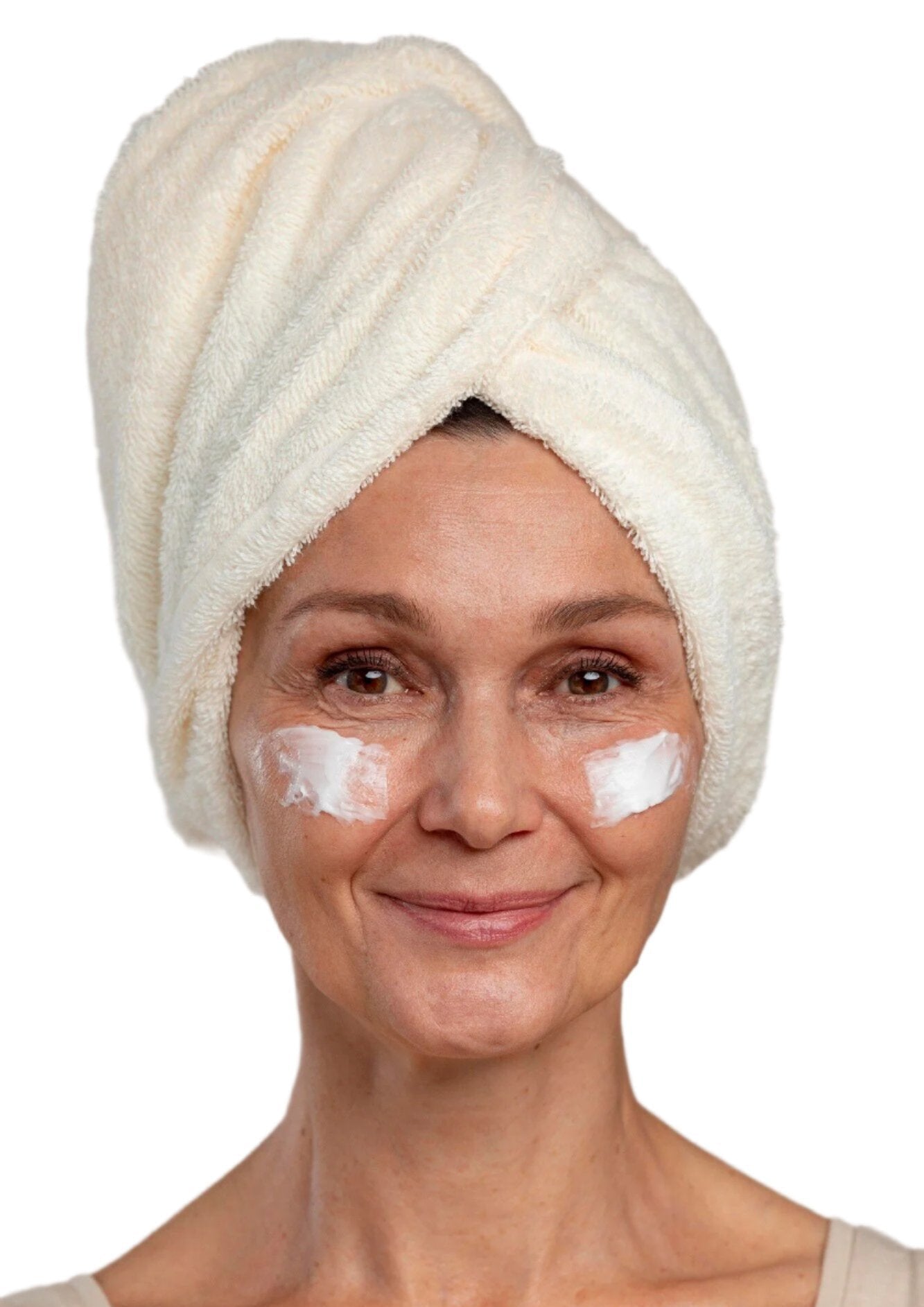 White woman in white head towel with face cream  on cheeks. Best anti-aging cream for face. Dermal Essentials Medical Grade Skincare.