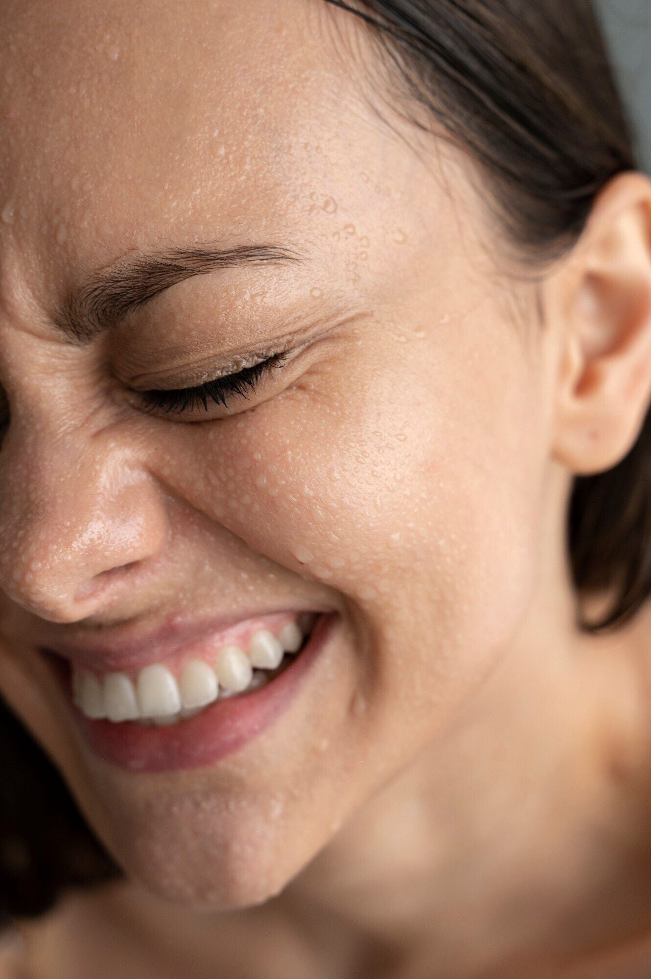 white woman with Spray on face to hydrate and calm irritated skin anytime