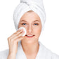 white woman in white robe and towel applying acne exfoliating facial pad dermal essentials clinical skincare