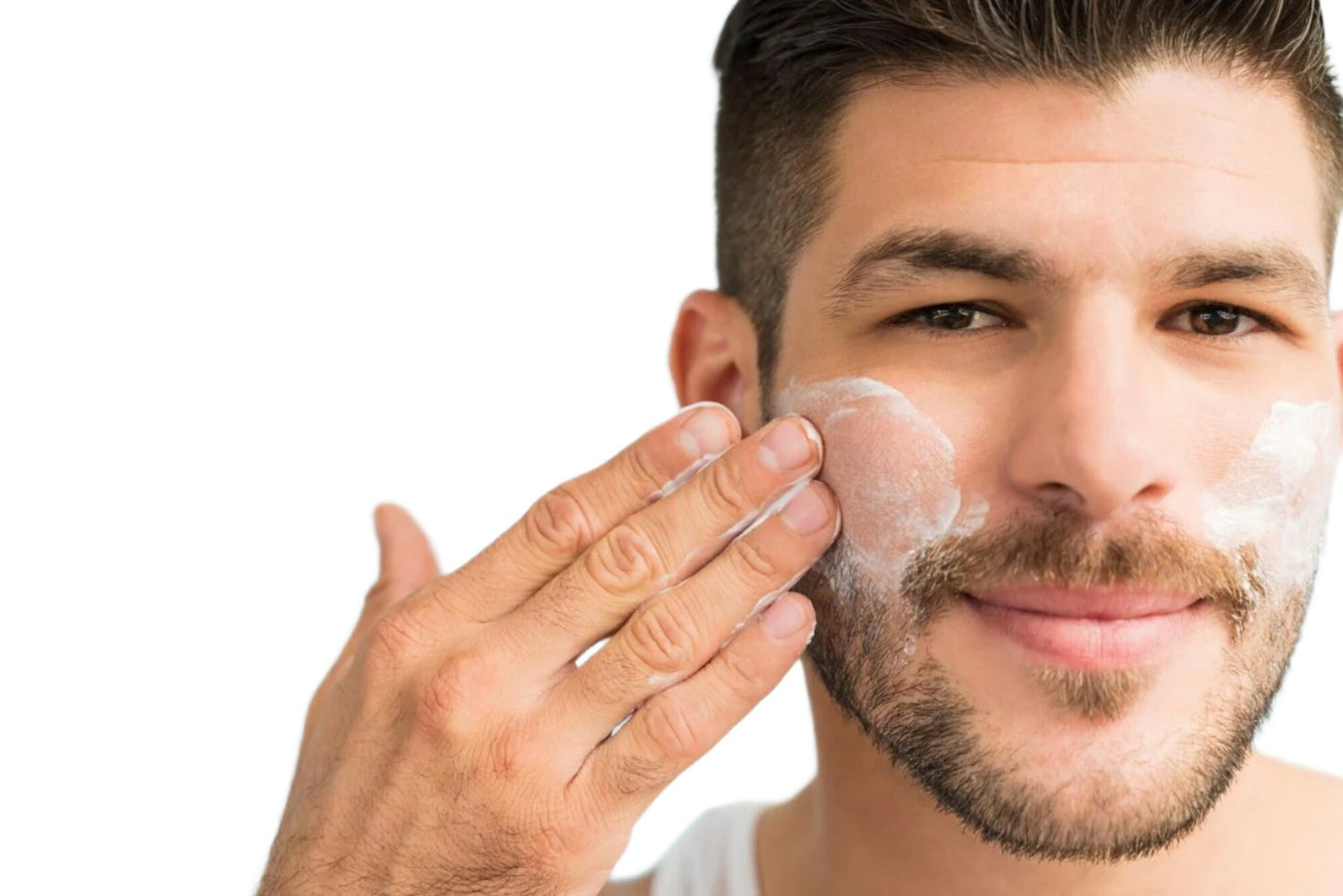 White man brown hair with beard applying best oil free moisturizer to face. Dermal Essentials medical grade skincare.