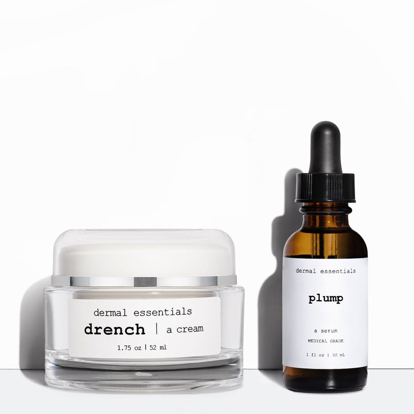 Two skincare products from Dermal Essentials on a white background: a clear jar of 'drench | a cream' with a white lid and label, and an amber glass dropper bottle labeled 'plump' with a black dropper cap.