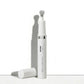A white cylindrical skincare bottle labeled 'erase dermal essentials' with a silver metallic neck detail, shown standing upright with its cap placed beside it on a clean white surface.