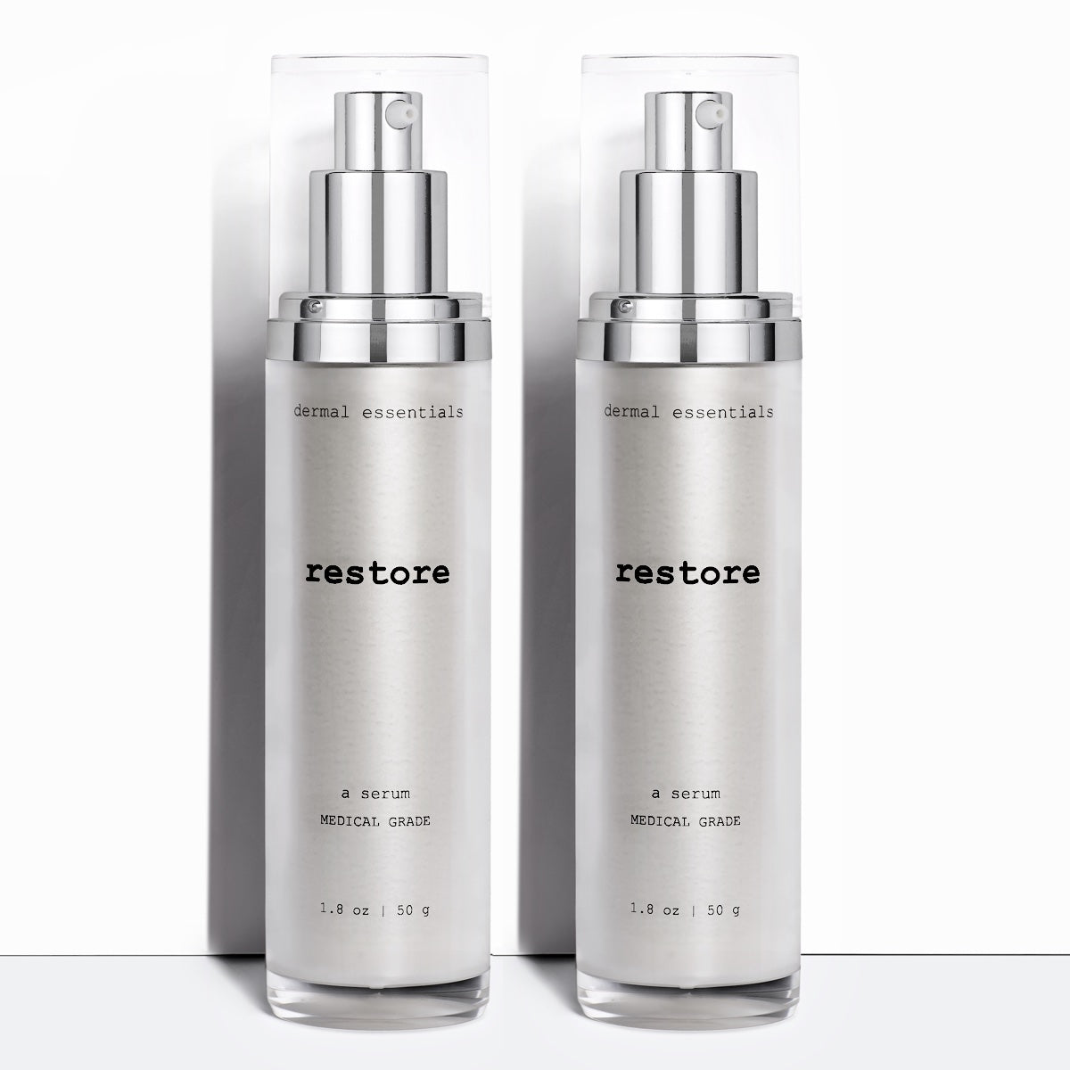 Two Silver cylinder plastic bottles black letters silver plastic pump clear plastic cap 1. 8 oz. Best anti-aging serum for the face.  Dermal Essentials Medical Grade Skincare.