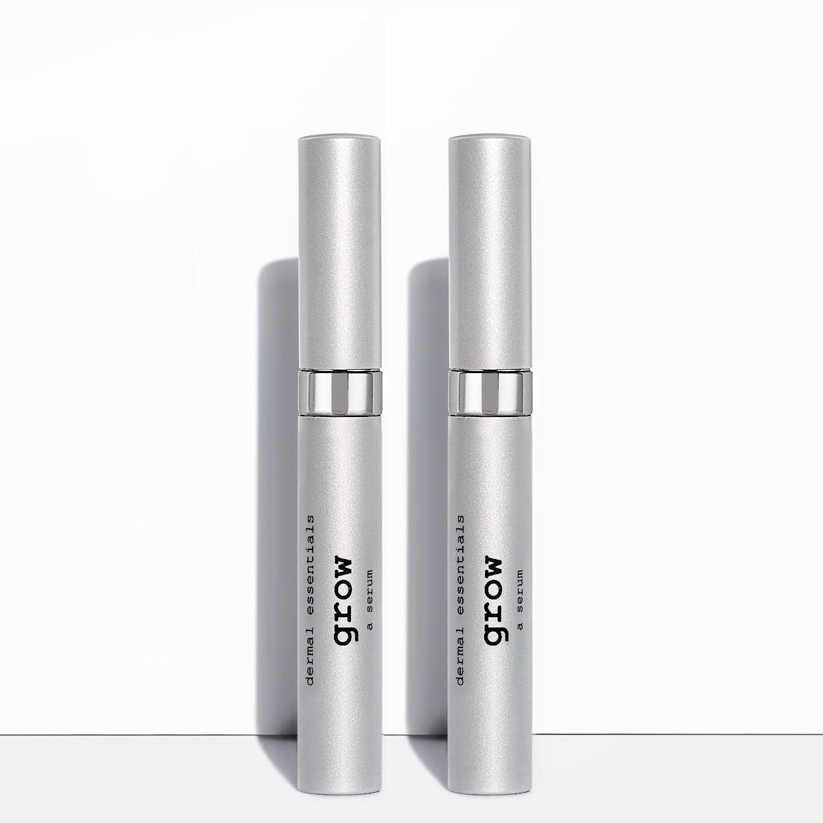 Two Silver cylinder tubes black letters white wand applicator 0.17 oz. Peptide Lash and Peptide Brow serum. Grow longer lashes and fuller brows Dermal Essentials Medical Grade Skincare