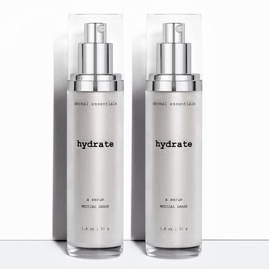 Two silver plastic cylinder bottles black letters silver pump clear cap  oil free moisturizer with peptide ceramides antioxidant niacinamide facial serum moisturizer Dermal Essentials Medical Grade Skincare  