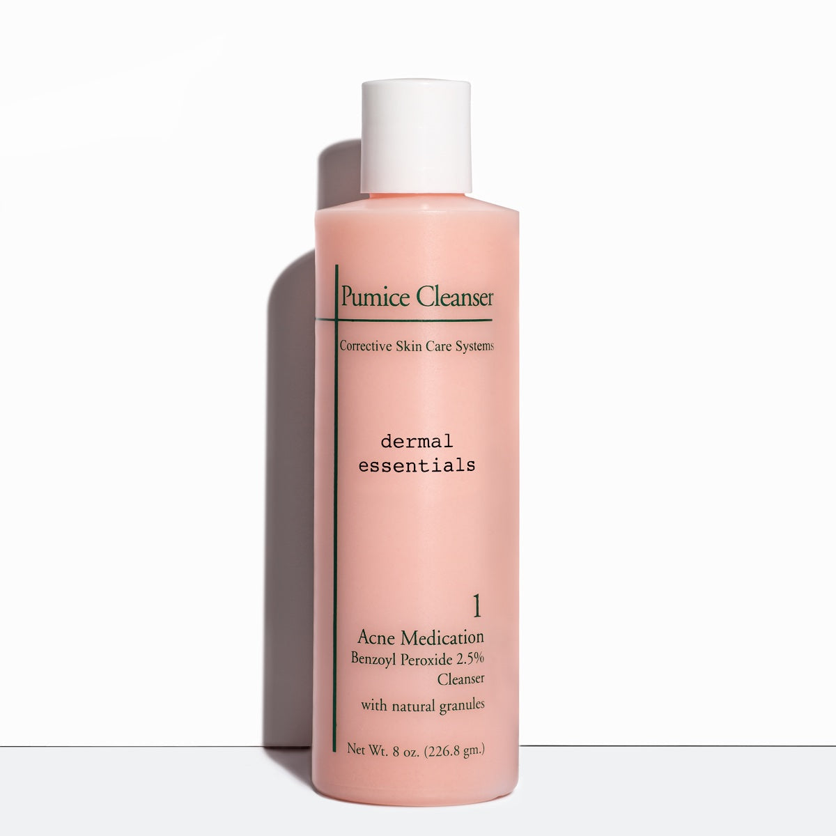 Full size 8 oz. Clear cylinder plastic squeeze  bottle green letters white cap pink acne cleanser. Pink product. Best  pumice cleanser for face and body.  Acne benzoyl peroxide face cleanser. Dermal Essentials Medical Grade Skincare. A mini size is 5 ml of this benzoyl peroxide acne facial cleanser skincare product  in a white plastic pump bottle with black letters and clear lid.