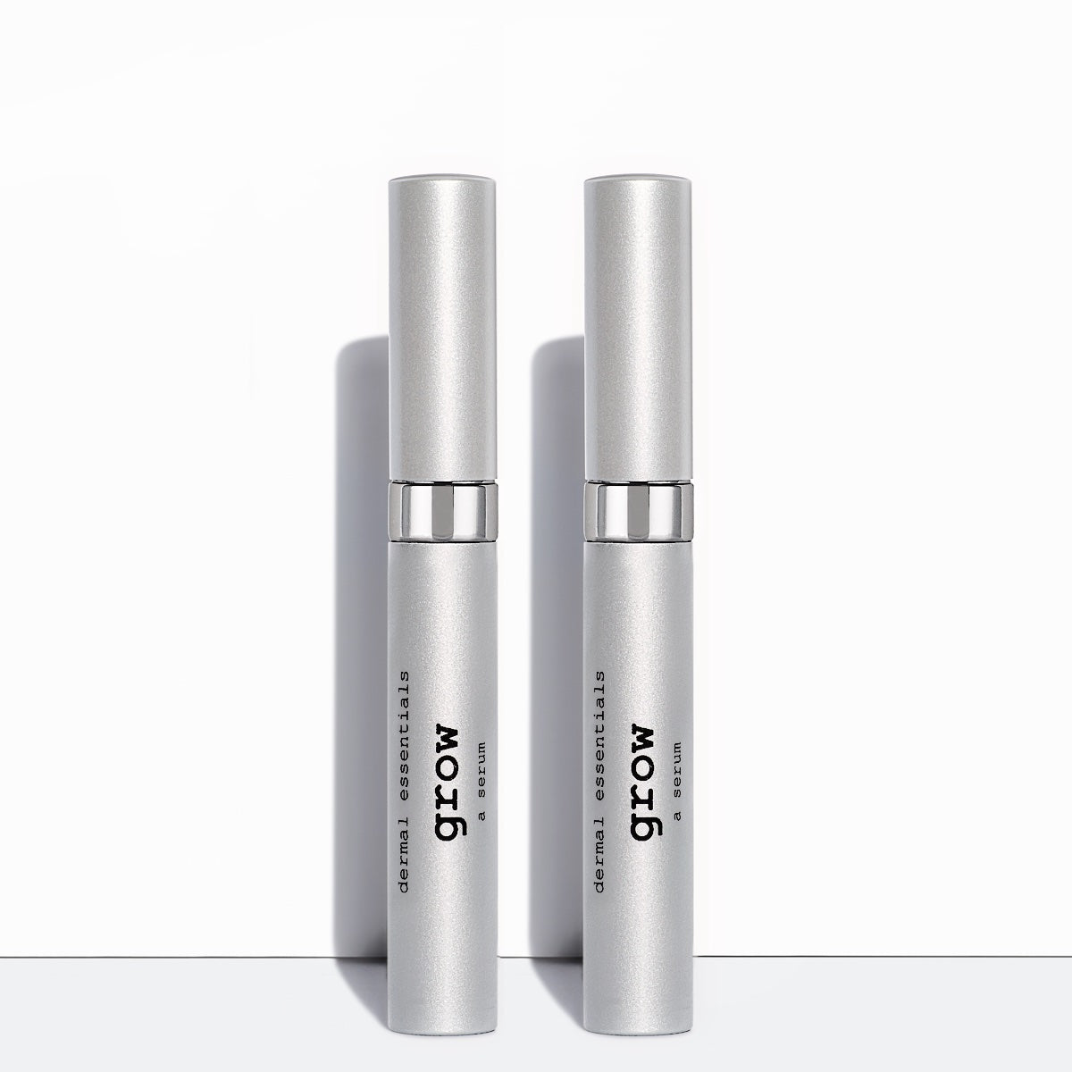  Two Silver cylinder tubes black letters white wand applicator 0.17 oz. Peptide Lash and Peptide Brow serum. Grow longer lashes and fuller brows Dermal Essentials Medical Grade Skincare  